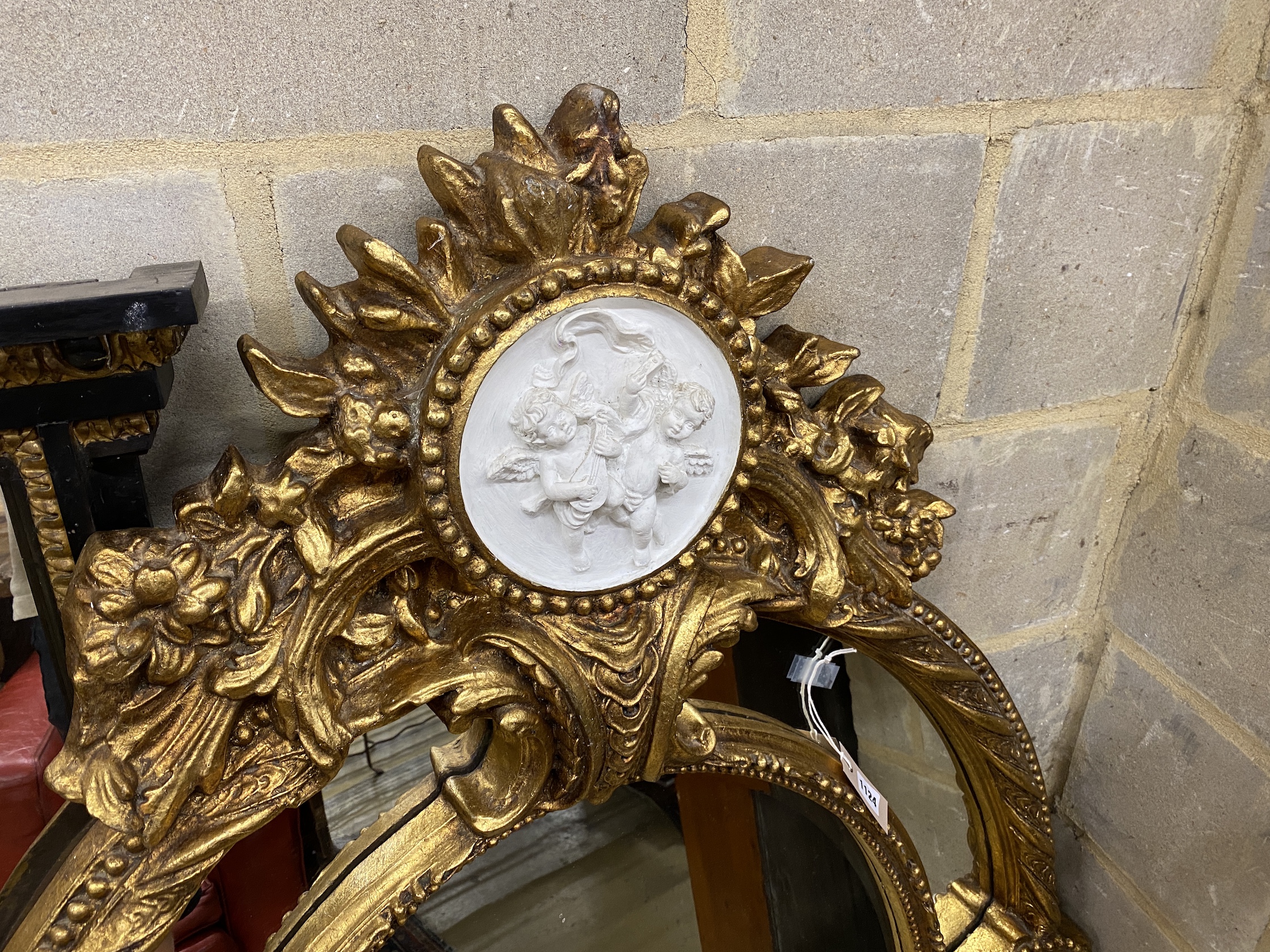 A Victorian style gilt composition and faux marble wall mirror, width 100cm, height 144cm